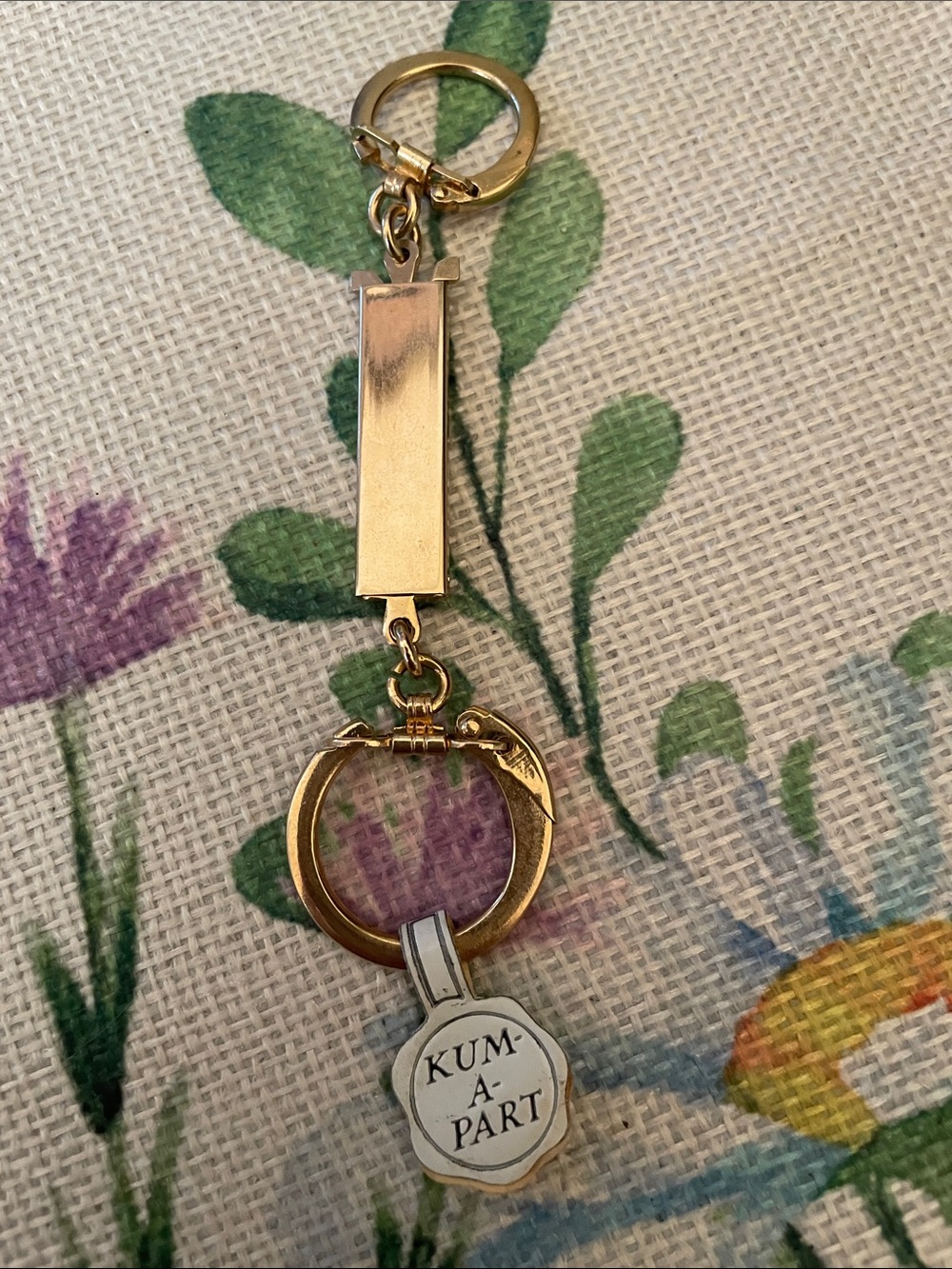 Gold-tone Keychain with 'KUM-A-PART' Tag